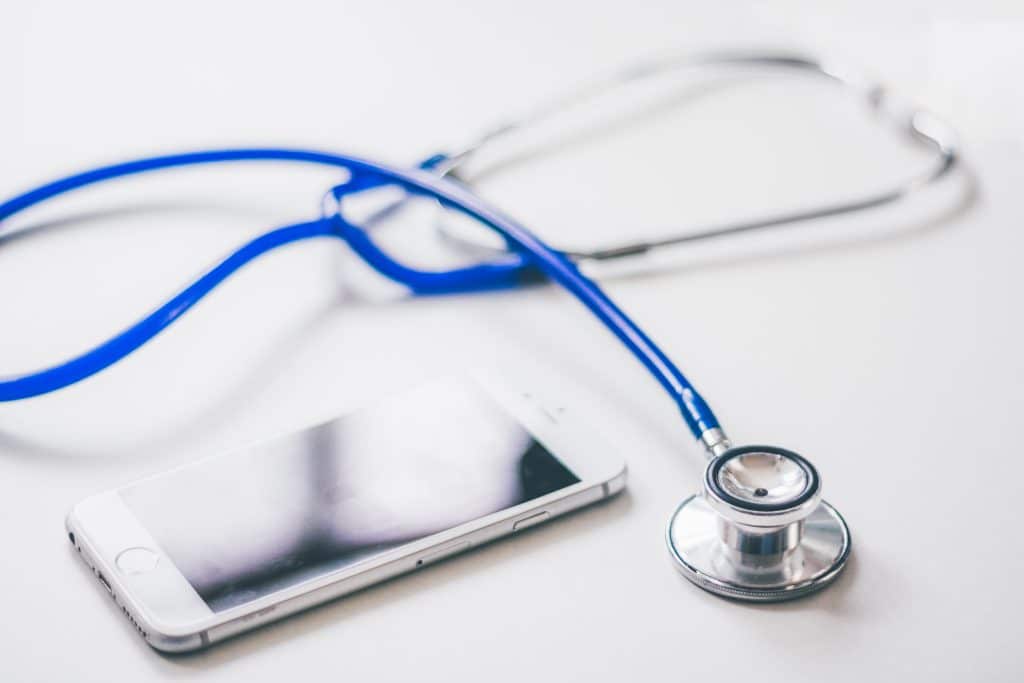 Office space with stethoscope on table of a company providing outsourced medical billing services.